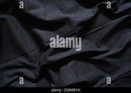 Deep Black Fabric with Dramatic Drapes and Shadows Stock Photo