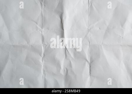 Texture of Folded Crumpled Paper with Light and Dark Areas Stock Photo