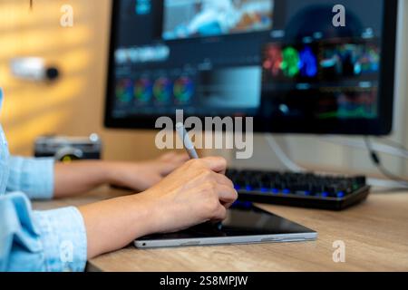 A freelance graphic designer working on video editing at home Stock Photo