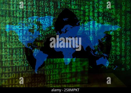 Computer hacker stealing data from a laptop Stock Photo