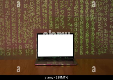 Laptop with space for your message on wooden table over binary code background in dark room. Cybercrime concept. Stock Photo