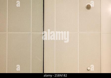 The background is a metal perforated structure, industrial minimalism. Stock Photo