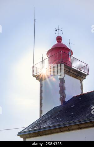 Sun rays at an old lighthouse Stock Photo