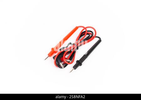 Set of digital multimeter test leads featuring red and black probes, arranged on a clean white background for clear visibility. Stock Photo
