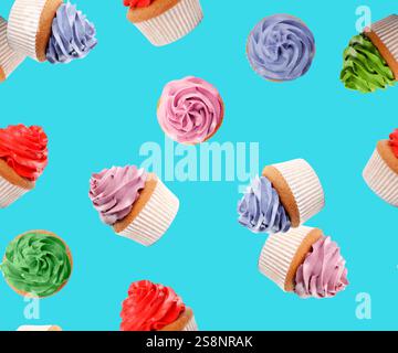 Pattern of cupcakes with bright cream on light blue background Stock Photo