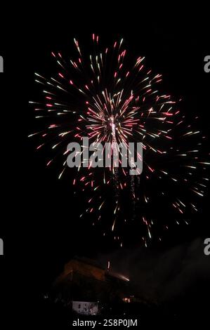 Colourful fireworks explode against a dark sky, creating a festive atmosphere, New Year's Eve, Stallbastei, Schlossberg, Graz, Styria Stock Photo