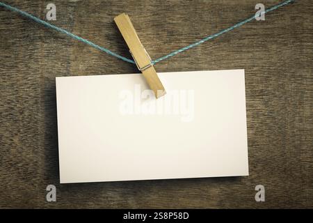 An image of a card on wire with clothes peg Stock Photo