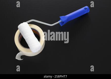 A typical painting roller isolated on black background Stock Photo