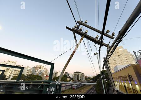 Old electric towers next to the train tracks in the city of Buenos Aires, Argentina Stock Photo