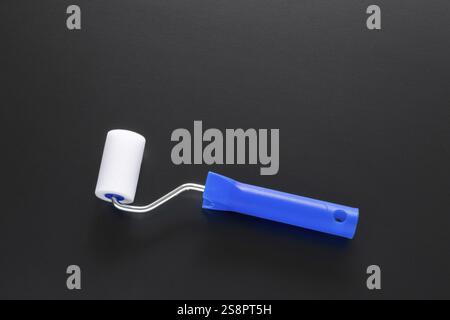 A typical painting roller isolated on black background Stock Photo