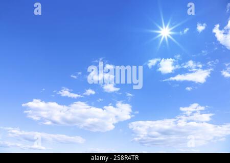An image of a typical beautiful blue sky sun clouds background Stock Photo