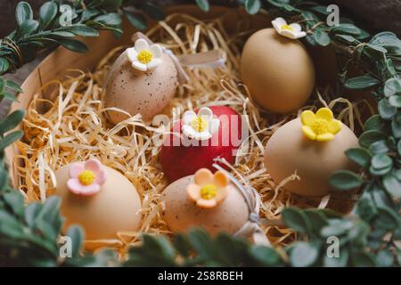 Easter decoration featuring colorful eggs arranged in a cozy nest Stock Photo