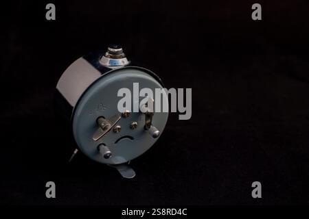 Back View of Vintage Alarm Clock with Wind-Up Mechanisms Stock Photo