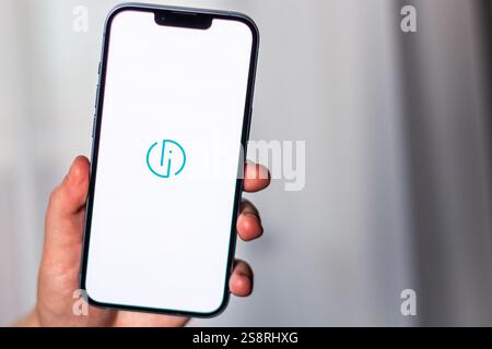 Kaliningrad, Russia 14.01.25 - Woman holding smartphone with smart id application logo on screen. Latvian identification app. Online banking. Stock Photo