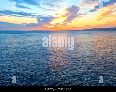 Sunset and clouds over the ocean Stock Photo