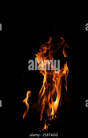 Close-up Shot of a Bonfire Flame in the Dark – Captivating Fire Texture and Burning Wood with Intense Heat, Perfect for Background Stock Photo