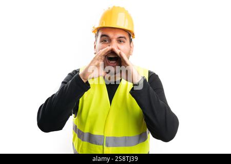 Adult builder man in work clothing fluorescent vest and safety hardhat with excited cheerful expression making shouting gesture isolated on white back Stock Photo
