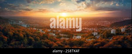 Panoramic colorful sunset over an European town. Suburban district of Heidelberg, Germany, surrounded by a forest, with dramatic vibrant colors, aeria Stock Photo