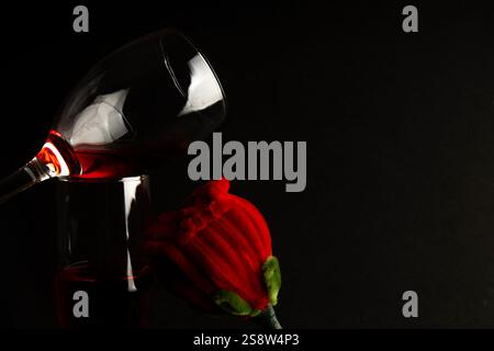 romantic red roses and wine toast on black background silhouette Stock Photo