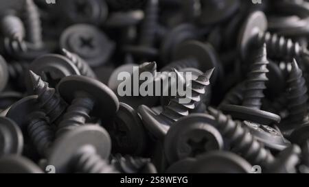 Close-up detailed background of metal screws for industrial hardware background. Macro photography of mechanical fasteners. The concept for construction, Stock Photo