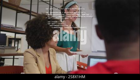 Image of data processing over diverse colleagues talking in creative office Stock Photo