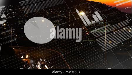 Financial data charts and graphs image over cityscape at night Stock Photo