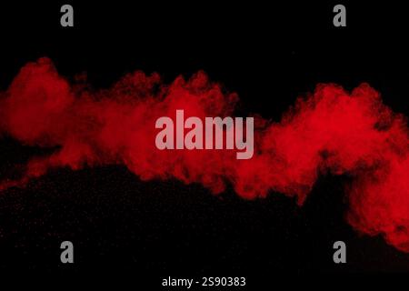 Abstract red powder dust explosion on black background Stock Photo - Alamy