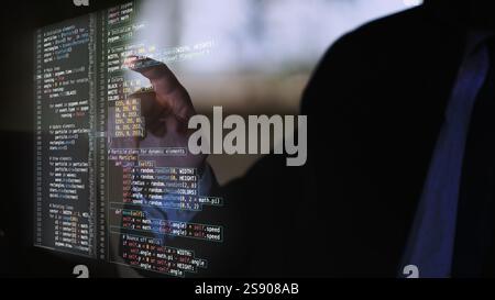 Hands interacting with virtual projection of fictional code, showcasing seamless blend of human ingenuity and digital simulation. Stock Photo