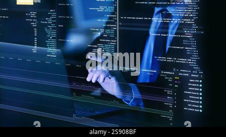 Close-up of hands on laptop keyboard, surrounded by floating, translucent layers of fictional code, representing virtual programming and system Stock Photo