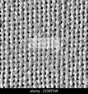 A detailed view of a gray seamless fabric pattern showcasing a smooth, consistent texture with subtle thread variations throughout. Stock Photo
