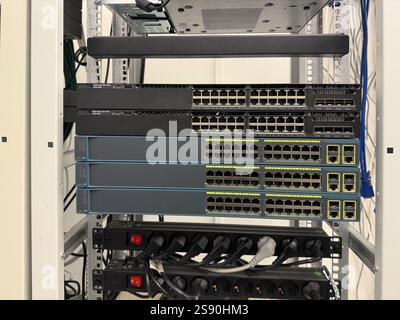 Close-up of racks and network cables. Infrastructure, networking, and data storage. Network technology Stock Photo