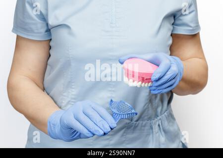 Dental impression tray and a layout of a human jaw Stock Photo - Alamy