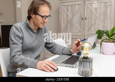 Focused and Innovative: A Professional Workspace in Action Stock Photo