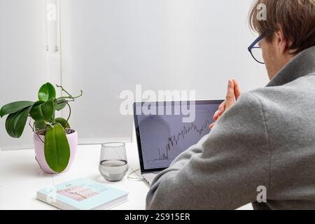 businessman is analyzing the stock market Stock Photo