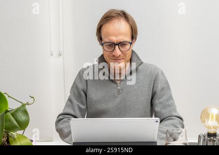 Dedicated Professional Using Technology for his business Stock Photo