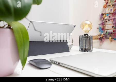 Modern Workspace with Digital Devices and Minimalist Decor Stock Photo