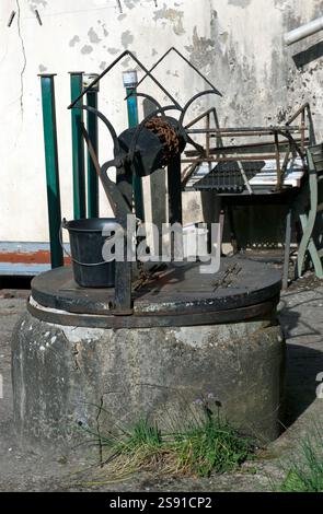 Close-up of an old Water Well, in a Cottage garden, in the Village of Preaux, Normandy, France Stock Photo