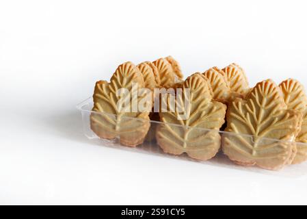 Classic Canadian maple leaf shaped cookies. Maple cream sandwiched between two crunchy cookies isolated on white background. Copy space. Stock Photo