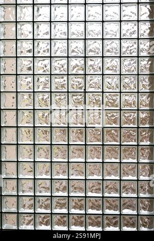 Frosted glass or glass brick separation wall. Exterior backlight, no people. Stock Photo