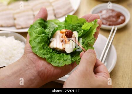 Bossam (sliced boiled pork belly wrapped with leaf vegetables ), Korean cuisine Stock Photo