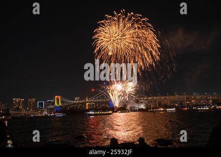 December 21, 2024, Tokyo Bay Fireworks show with Rainbow Bridge in the background, Japan.  Stock Photo