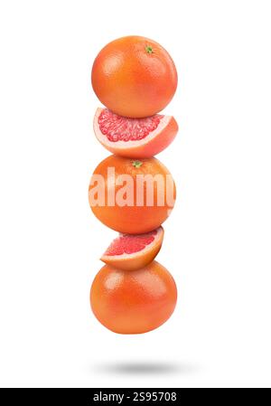 Fresh grapefruits in air on white background Stock Photo