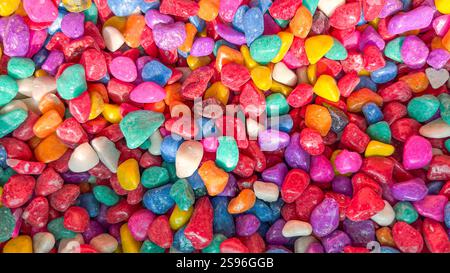 Close-up of multicoloured decorative pebbles, vibrant polished stones in assorted colours and textures Stock Photo