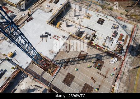 Aerial Top View of a Construction Site with Workers and Rebar Stock Photo