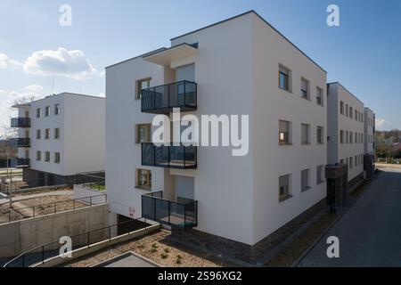 Photo inspiration: Modern White Apartment Buildings With Underground Parking Entrance Photo Inspiration