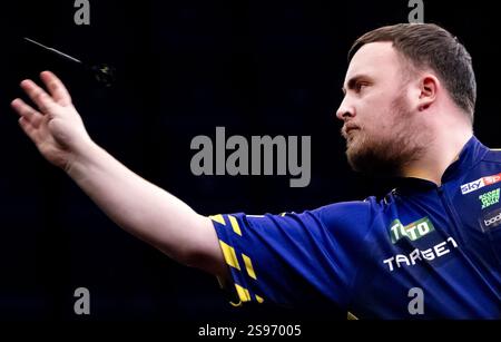 Luke Littler during his first round match against Andy Baetens on day