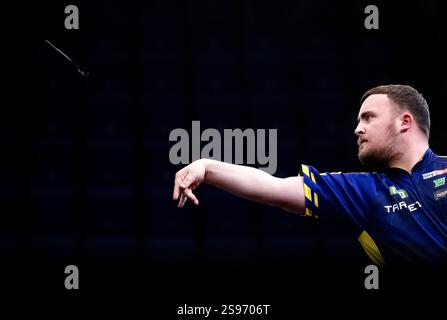 Luke Littler during his first round match against Andy Baetens on day