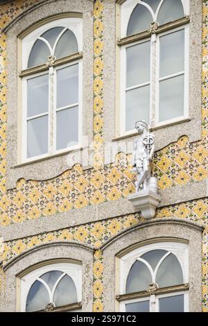Building Facade with Figure and Ceramic Tiles - Guimaraes Portugal. Stock Photo