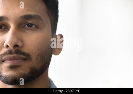 Close up cropped shot attractive handsome dark haired male face Stock Photo