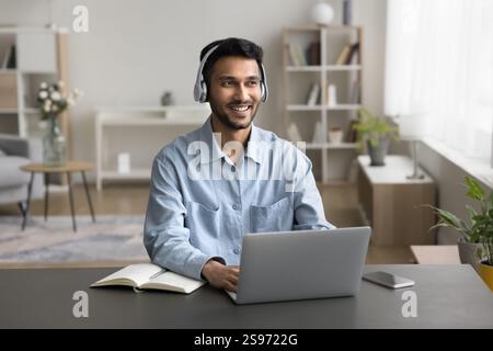 Millennial man using modern tech for successful work from home Stock Photo